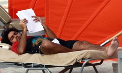 Adrian Grenier reading at the beach 2.jpg
