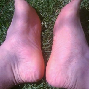 Ticklish Bare feet in the grass