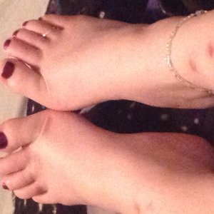 My feet with purple polish, toe ring and anklet