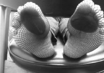 mary_s_feet_in_fishnets_in_b_w_11_by_osco89-d7flrrx.jpg