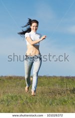 Croptop brunette barefoot in jeans.jpg