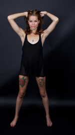 Standing-bft-in-short-blk-dress-leg-tats_JulysFoot.png