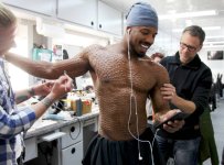 Michael B Jordan tickled by brushes.jpg