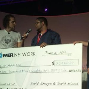 On stage at a work convention recieving a check