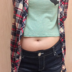 My tummy in a crop top and flannel