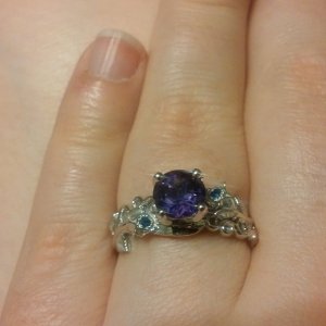 My custom engagement ring my husband got for me. Yes that is my birth stone.