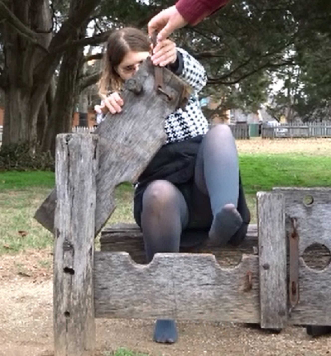 Ankles going in for tickling in the stocks