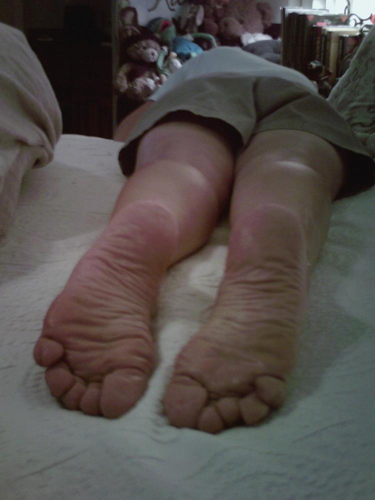 Crawled across the bed to get somethinfgthat fell on the floor.  Flip flops fell off my feet = Bare soles in your face.