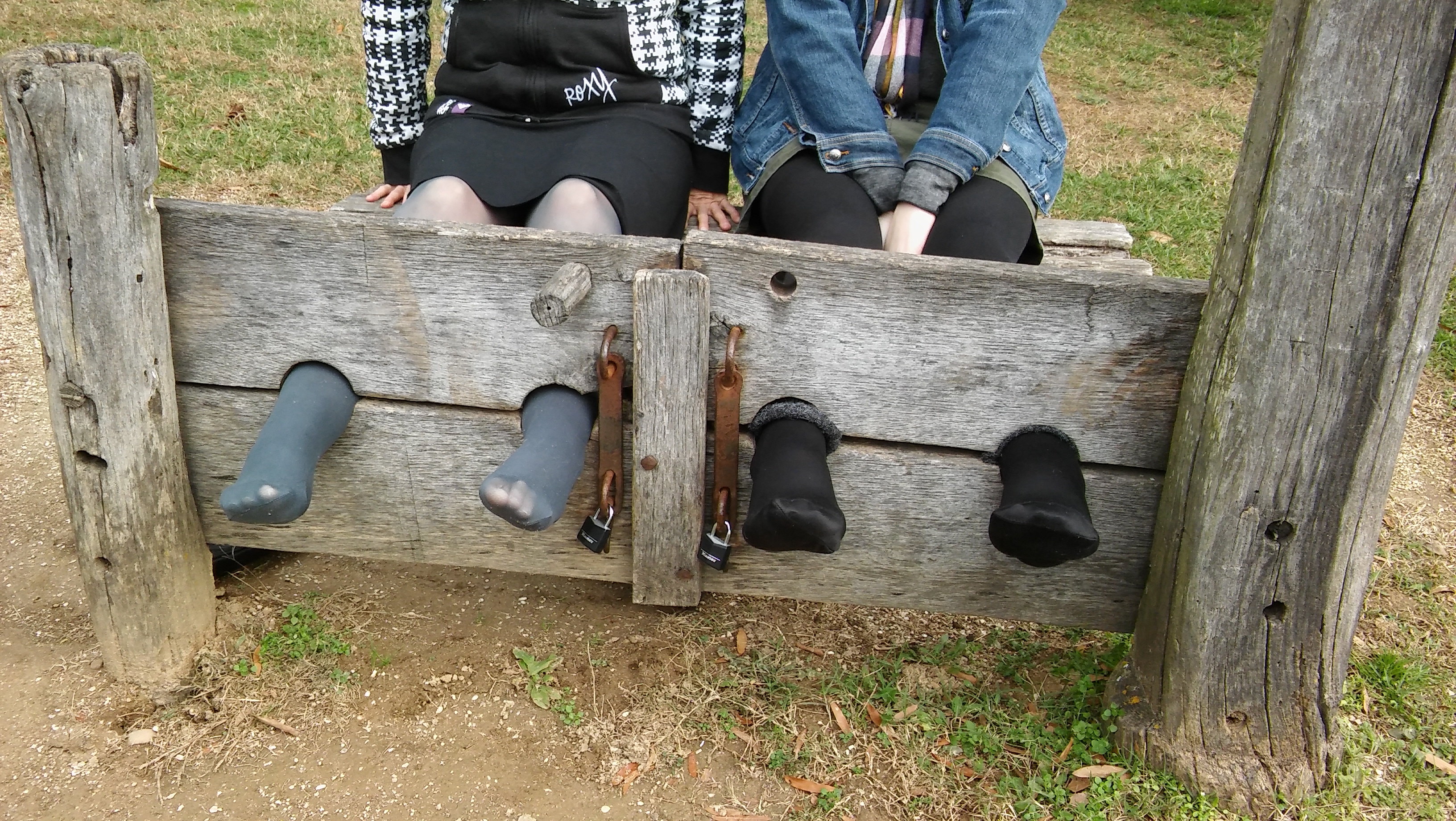 Feet in nylons and tights in the stocks