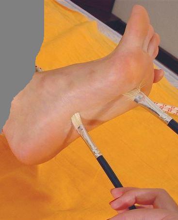 foottickling with brushes