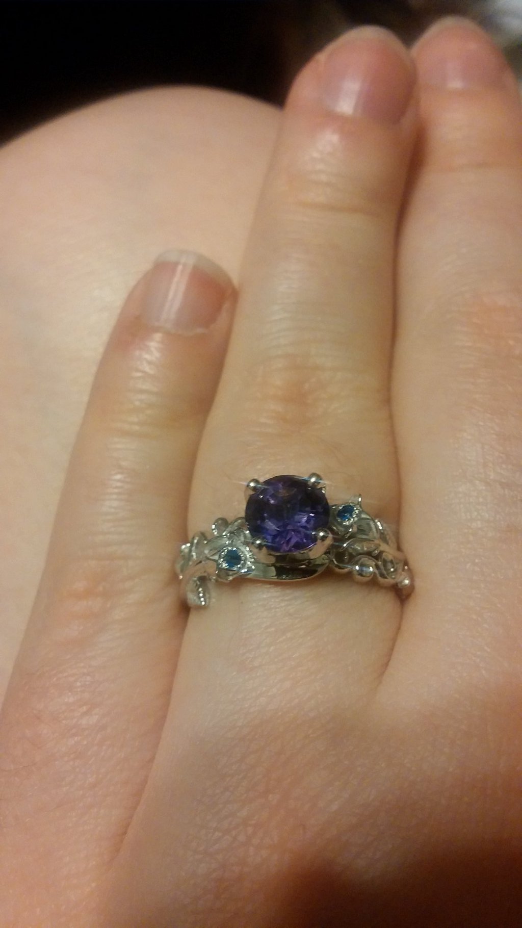 My custom engagement ring my husband got for me. Yes that is my birth stone.